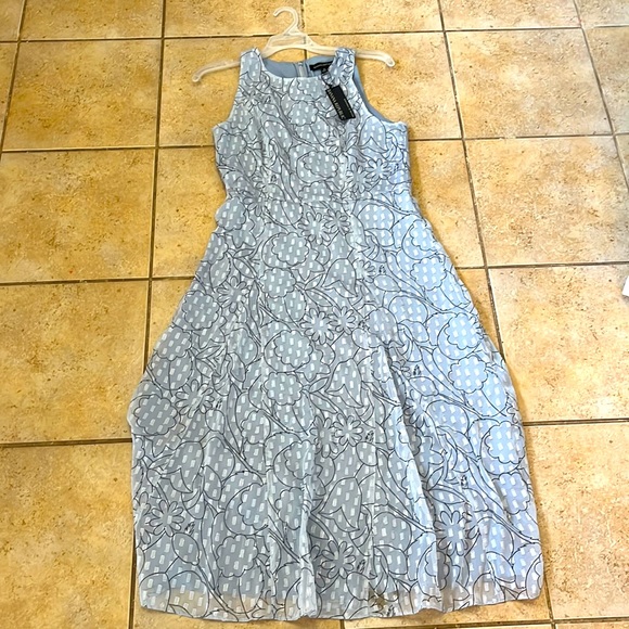 Light blue long dress with silver rectangular detail and black line design - Picture 1 of 5